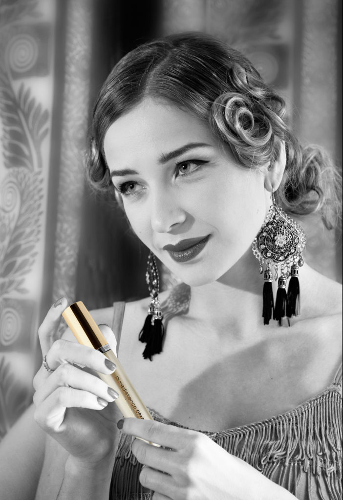 model Egija Zviedre in Paris holding Puredistance OPARDU perfume
