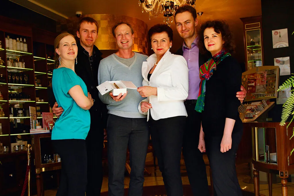 Puredistance founder Jan Ewoud Vos with the Missala family in the perfumery in Warsaw